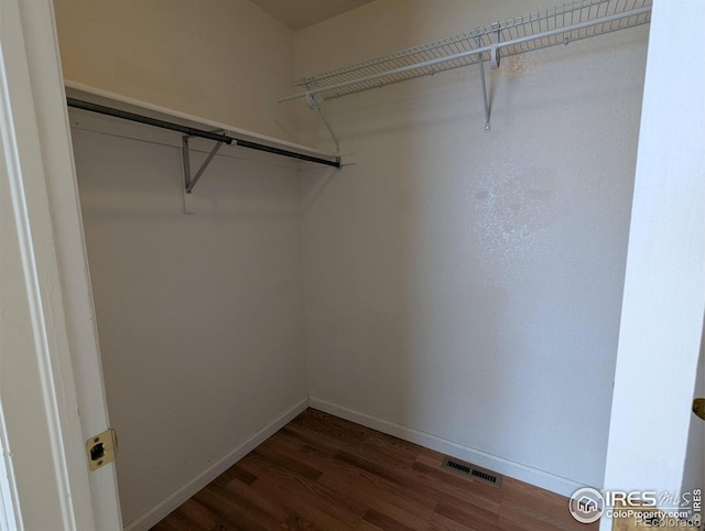 3705 Dove Ln, Evans, CO 80620 - spacious closet featuring dark wood finished floors