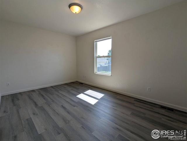 3705 Dove Ln, Evans, CO 80620 - empty room featuring wood finished floors and baseboards