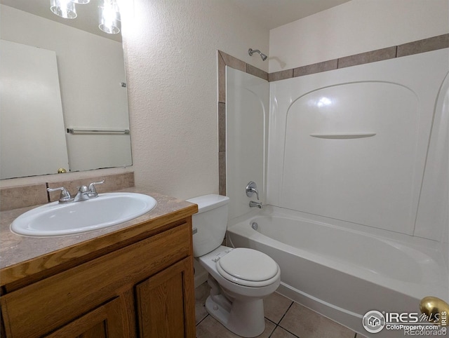 3705 Dove Ln, Evans, CO 80620 - bathroom featuring vanity, shower / bath combination, tile patterned floors, and a textured wall