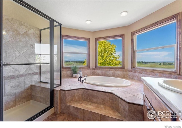 8276 Blackwood Dr, Windsor, CO 80550 - bathroom featuring a garden tub, a stall shower, vanity, and recessed lighting