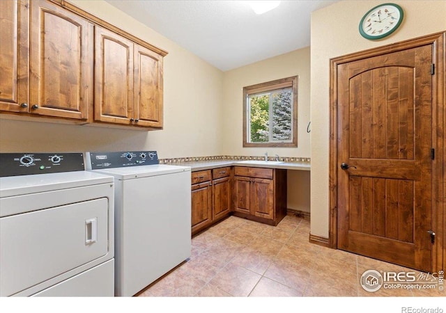 8276 Blackwood Dr, Windsor, CO 80550 - laundry room featuring cabinet space, washing machine and dryer, and light tile patterned flooring