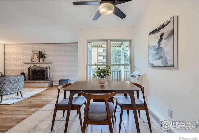 3030 Oneal Pkwy # 21R, Boulder, CO 80301 - dining room featuring a ceiling fan, a fireplace, and light wood-style floors