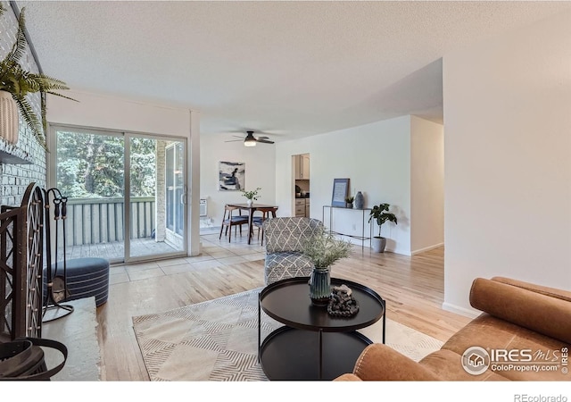 3030 Oneal Pkwy # 21R, Boulder, CO 80301 - living room with light wood-style floors, ceiling fan, and a textured ceiling