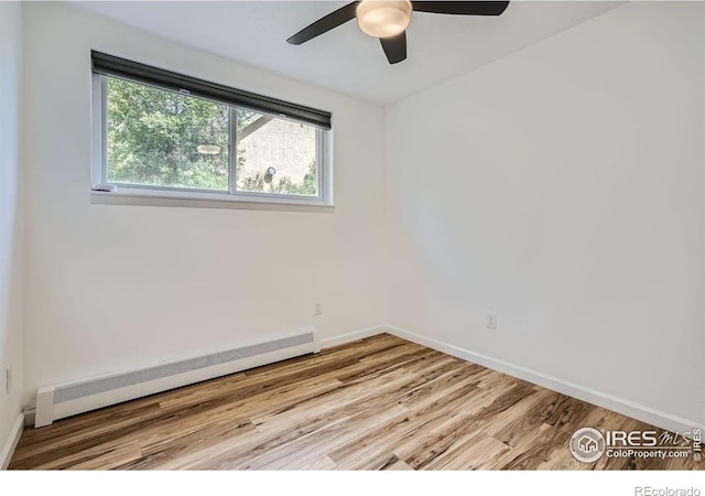 3030 Oneal Pkwy # 21R, Boulder, CO 80301 - spare room featuring a baseboard heating unit, wood finished floors, and ceiling fan