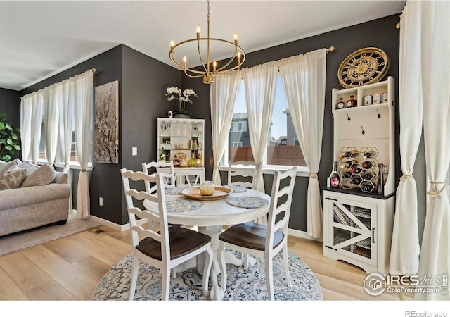 1228 104th Avenue Ct, Greeley, CO 80634 - dining space featuring a chandelier and light wood-style floors