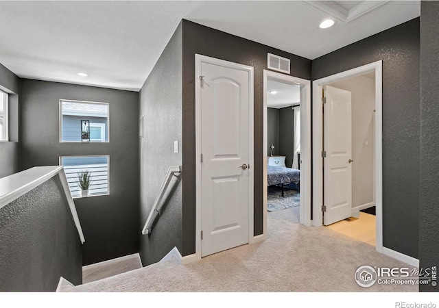 1228 104th Avenue Ct, Greeley, CO 80634 - hallway featuring an upstairs landing, carpet flooring, a textured wall, and recessed lighting