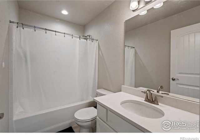 1228 104th Avenue Ct, Greeley, CO 80634 - bathroom with vanity, shower / bath combo with shower curtain, recessed lighting, and a textured wall