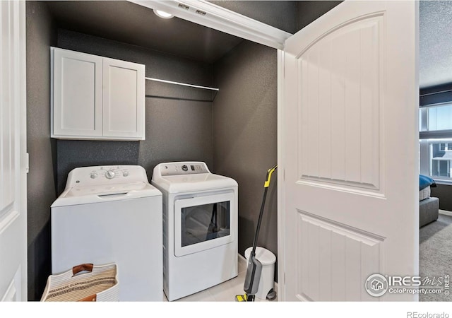 1228 104th Avenue Ct, Greeley, CO 80634 - laundry room featuring cabinet space and washer and clothes dryer