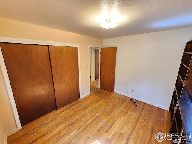 1107 Delmar St, Sterling, CO 80751 - unfurnished bedroom featuring wood finished floors and a closet