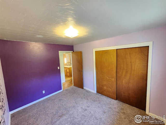 1107 Delmar St, Sterling, CO 80751 - unfurnished bedroom featuring carpet flooring and a closet