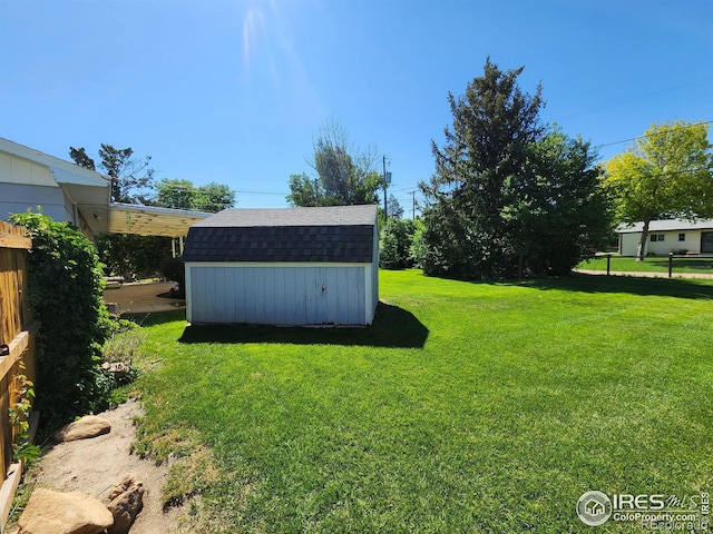 1107 Delmar St, Sterling, CO 80751 - view of yard featuring a storage unit