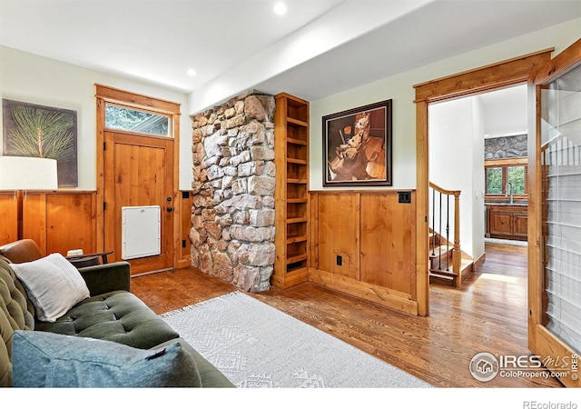 2958 6th St, Boulder, CO 80304 - living room featuring wainscoting, wood finished floors, stairs, recessed lighting, and wooden walls