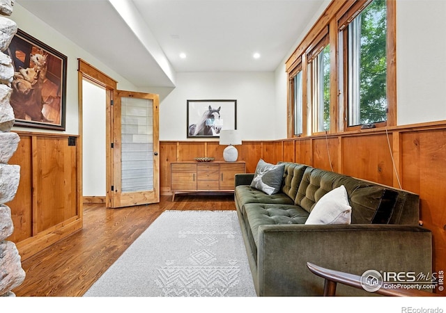 2958 6th St, Boulder, CO 80304 - living area featuring wainscoting, wood finished floors, wood walls, and recessed lighting
