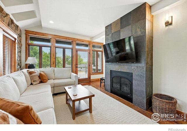 2958 6th St, Boulder, CO 80304 - living area featuring a fireplace, vaulted ceiling, wood finished floors, and recessed lighting