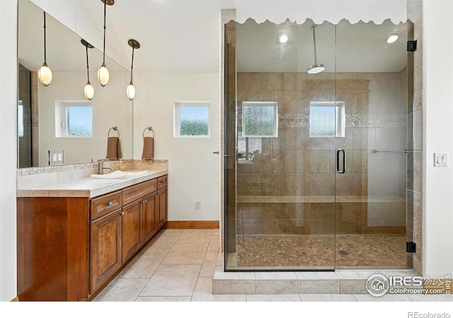 2958 6th St, Boulder, CO 80304 - bathroom featuring vanity, a stall shower, and tile patterned flooring