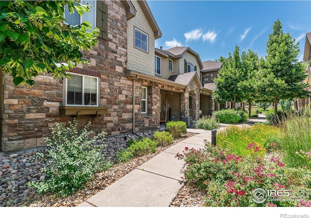 15233 W 65th Ave Unit C, Arvada, CO 80007 - view of exterior entry featuring stone siding