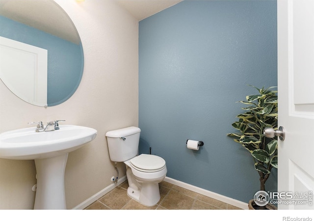 15233 W 65th Ave Unit C, Arvada, CO 80007 - half bath with toilet and tile patterned flooring