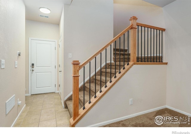 15233 W 65th Ave Unit C, Arvada, CO 80007 - staircase featuring baseboards