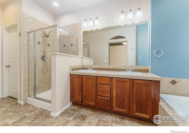 15233 W 65th Ave Unit C, Arvada, CO 80007 - bathroom featuring a shower stall, double vanity, and a bath