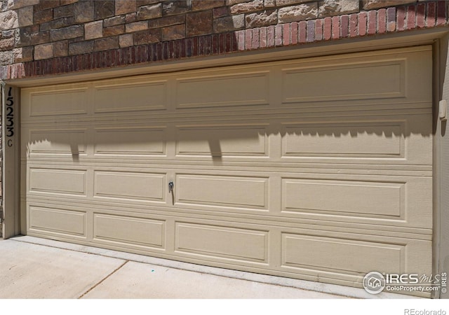 15233 W 65th Ave Unit C, Arvada, CO 80007 - garage featuring concrete driveway