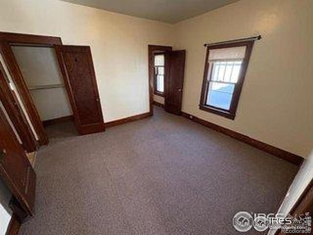709 S 2nd Ave S, Sterling, CO 80751 - unfurnished bedroom featuring carpet flooring