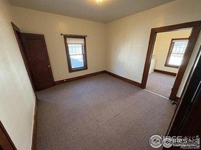 709 S 2nd Ave S, Sterling, CO 80751 - unfurnished room featuring carpet floors and baseboards