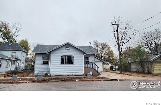 709 S 2nd Ave S, Sterling, CO 80751 - bungalow-style house featuring a garage and roof with shingles