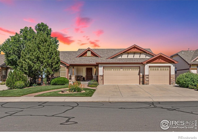 1787 Gore Creek Ct, Windsor, CO 80550 - craftsman inspired home with stone siding, a garage, and concrete driveway