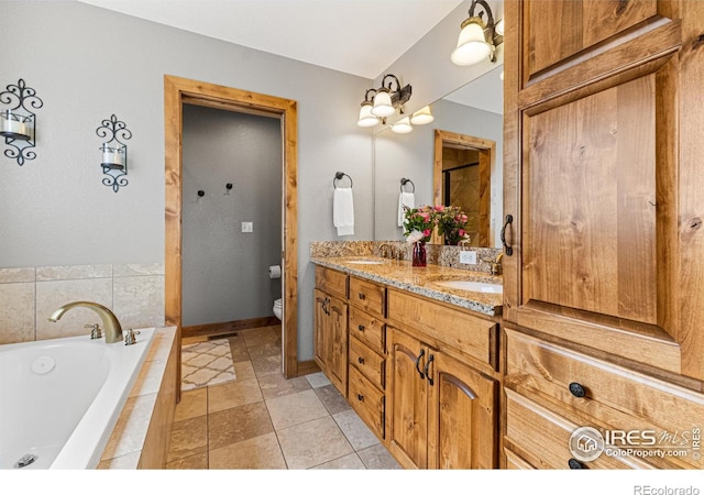 1787 Gore Creek Ct, Windsor, CO 80550 - full bathroom with double vanity, a bath, and tile patterned floors