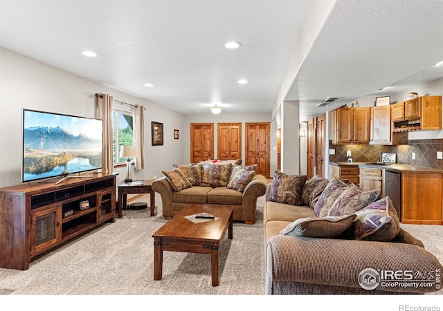 1787 Gore Creek Ct, Windsor, CO 80550 - living area featuring recessed lighting, light carpet, bar, and a textured ceiling