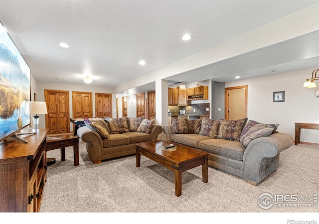 1787 Gore Creek Ct, Windsor, CO 80550 - living area with light carpet and recessed lighting