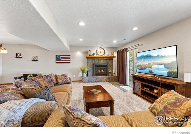 1787 Gore Creek Ct, Windsor, CO 80550 - carpeted living room featuring a fireplace, recessed lighting, and a textured ceiling