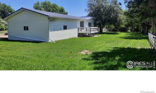 15296 County Road 39, Sterling, CO 80751 - view of grassy yard featuring a wooden deck