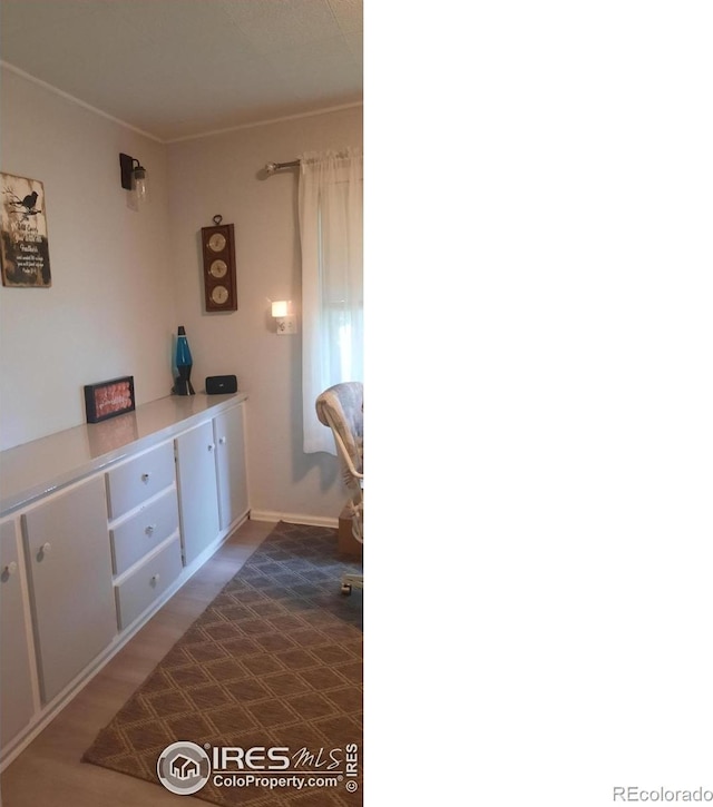 15296 County Road 39, Sterling, CO 80751 - corridor with baseboards and wood finished floors
