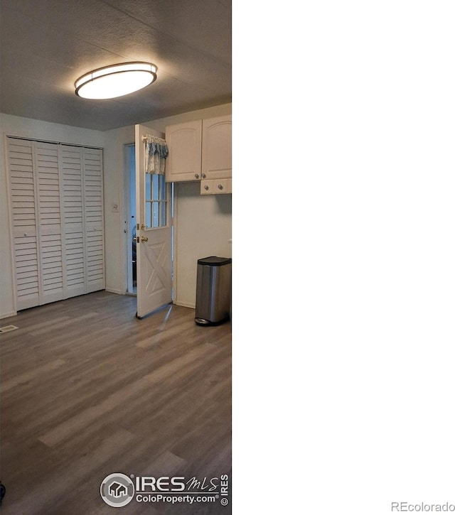 15296 County Road 39, Sterling, CO 80751 - kitchen with white cabinetry and wood finished floors