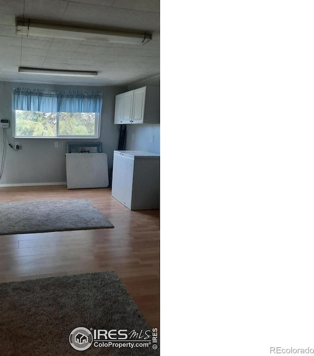 15296 County Road 39, Sterling, CO 80751 - interior space with light wood finished floors and white cabinetry