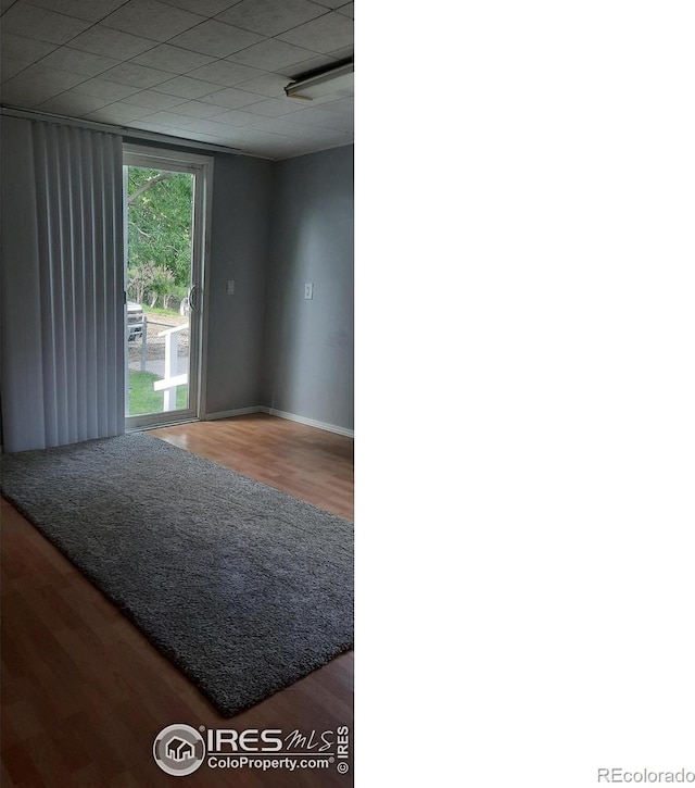 15296 County Road 39, Sterling, CO 80751 - unfurnished room featuring wood finished floors and baseboards