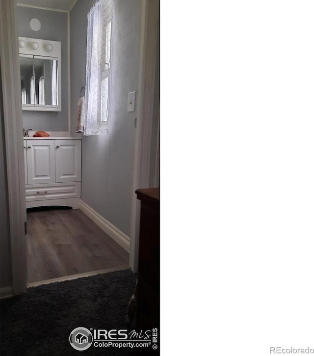 15296 County Road 39, Sterling, CO 80751 - bathroom with baseboards and wood finished floors