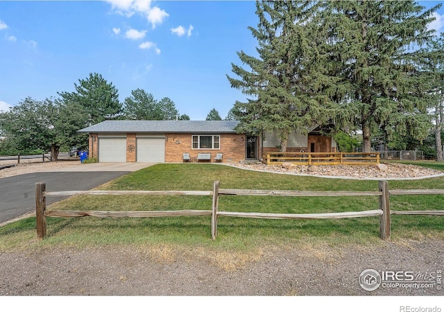 108 40th Ave, Greeley, CO 80634 - view of front of property with driveway, a garage, and brick siding