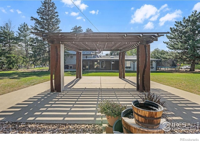 108 40th Ave, Greeley, CO 80634 - view of patio featuring a pergola and a trampoline