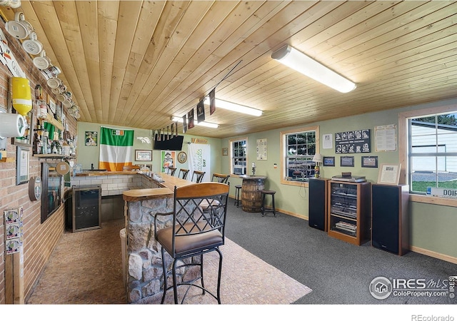 108 40th Ave, Greeley, CO 80634 - kitchen featuring beverage cooler, carpet, and wooden ceiling