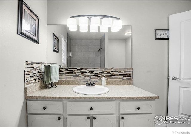 108 40th Ave, Greeley, CO 80634 - full bath with tasteful backsplash, vanity, and a tile shower