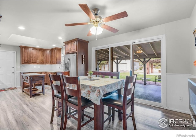 108 40th Ave, Greeley, CO 80634 - dining room featuring light wood-type flooring, a ceiling fan, and recessed lighting