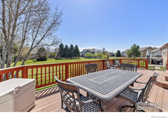 11722 Elmer Linn Dr, Longmont, CO 80504 - deck with outdoor dining space, a lawn, and a residential view