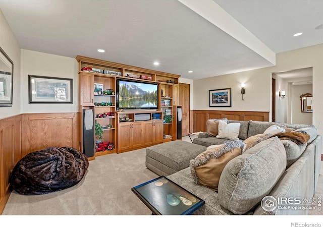 6619 Ridgeline Dr, Timnath, CO 80547 - living area with light colored carpet, a wainscoted wall, and recessed lighting
