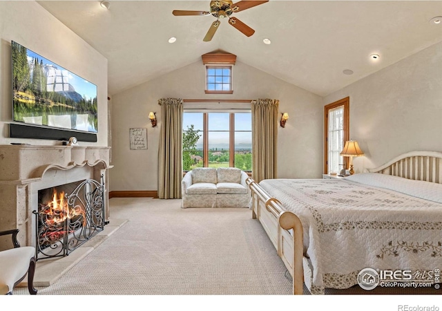 6619 Ridgeline Dr, Timnath, CO 80547 - carpeted bedroom with lofted ceiling, a warm lit fireplace, a ceiling fan, and recessed lighting