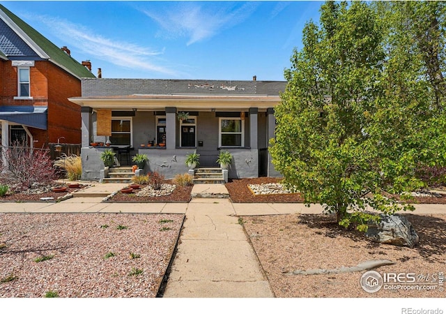 2955 Columbine St, Denver, CO 80205 - view of front of home with covered porch and brick siding