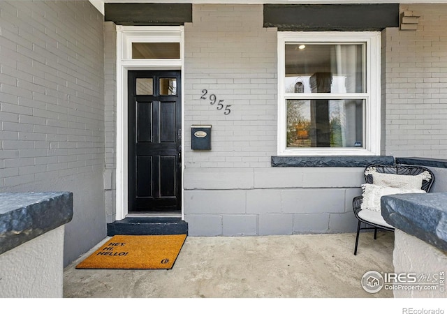 2955 Columbine St, Denver, CO 80205 - doorway to property featuring brick siding