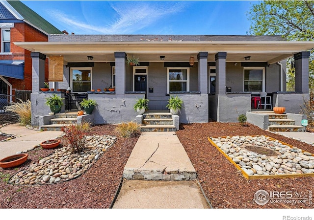 2955 Columbine St, Denver, CO 80205 - view of front of house with brick siding and a porch