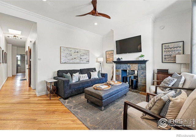 2955 Columbine St, Denver, CO 80205 - living room featuring light wood-type flooring, a ceiling fan, recessed lighting, crown molding, and a fireplace